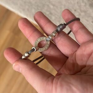 Links of London silver and cord bracelet.